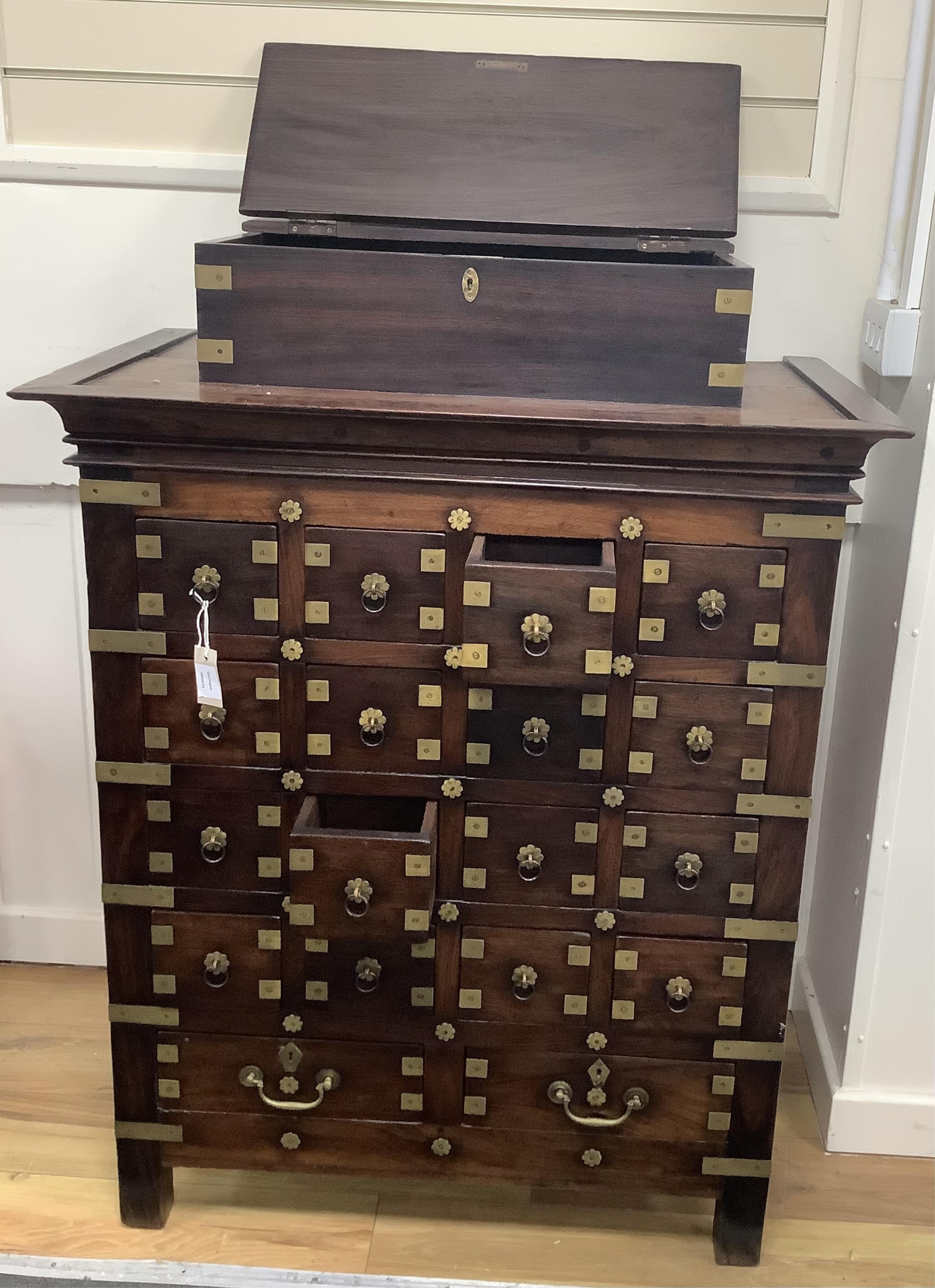 A late 19th century Anglo Indian, Pondicherry, hardwood apothecary chest, eighteen drawers with inner partitions and one attached top chest, width 93cm, depth 56cm, height 126cm. Condition - good